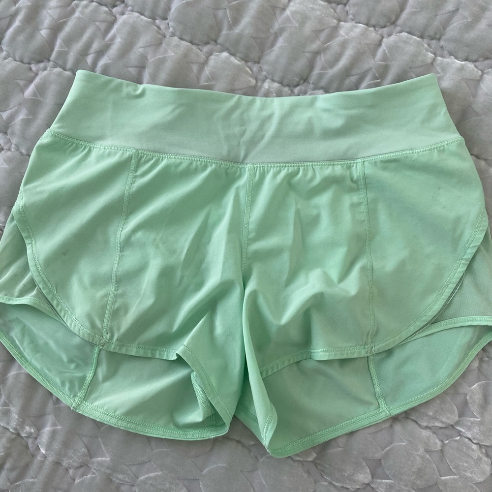 Lululemon mint / sea foam green running shorts.